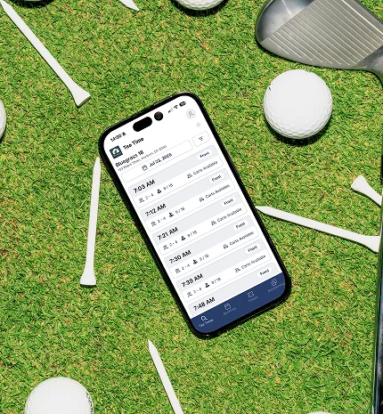 Smartphone on grass showing the Tee On tee time booking app